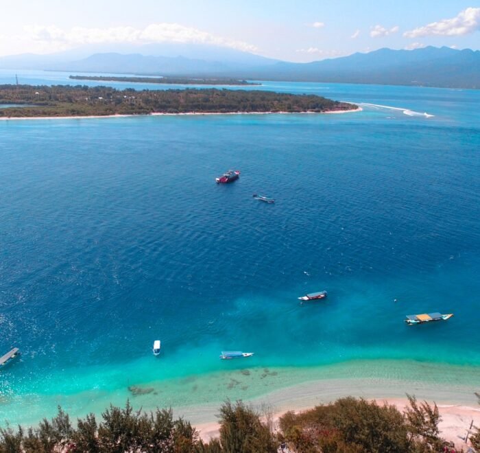 7 Days Bali and Gili Trawangan itinerary featuring Ubud culture, Kintamani volcano, Tanah Lot sunset, Gili beaches, snorkeling, Uluwatu Temple cliffs, and traditional Kecak fire dance.